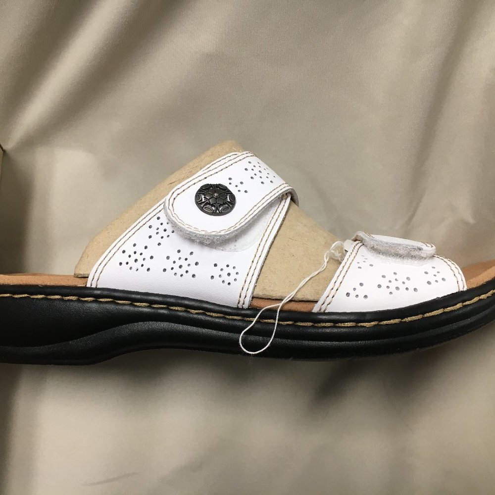 Clarks white, black, and tan sandals